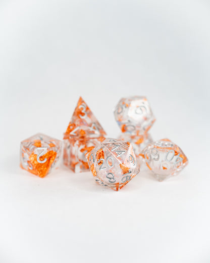 Alms for Angels | 7 Piece Liquid Core Dice Set - Emberglow Gaming